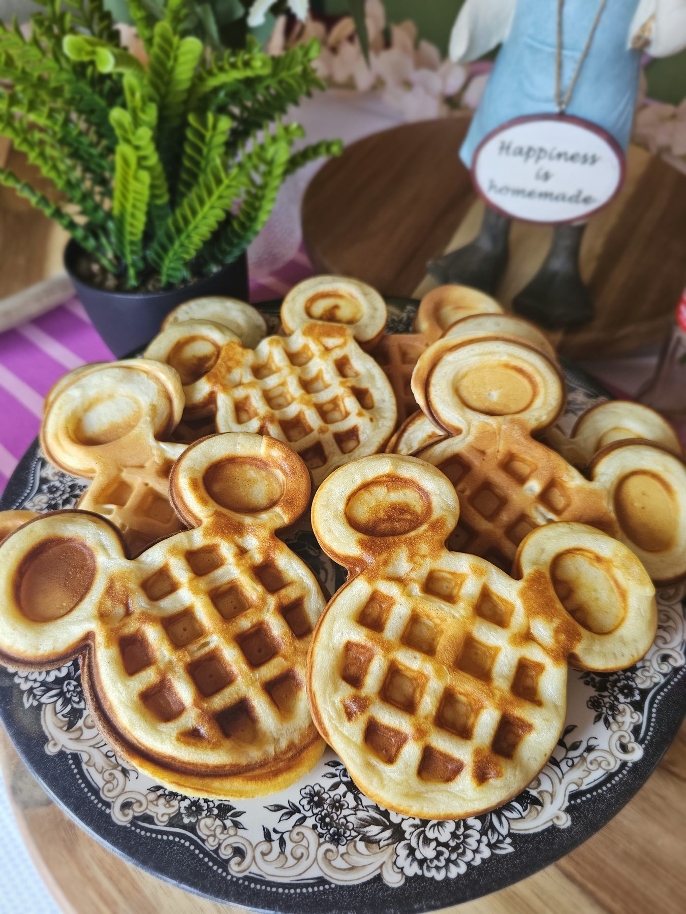 Fresh character-shaped waffles arranged on a serving plate