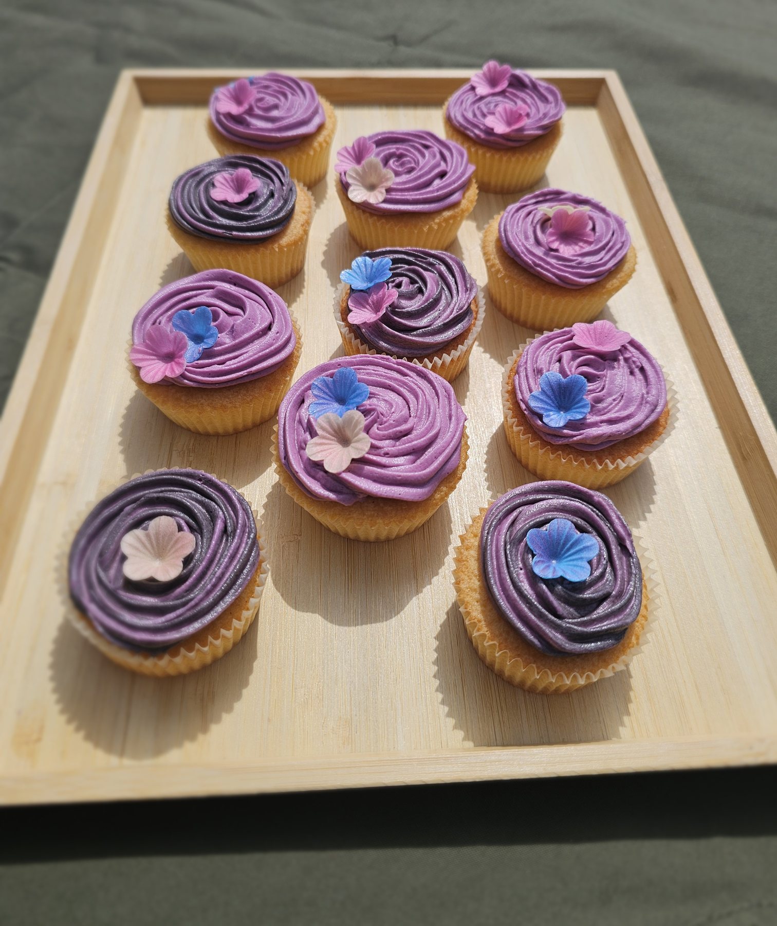 Purple cupcakes with flower decorations